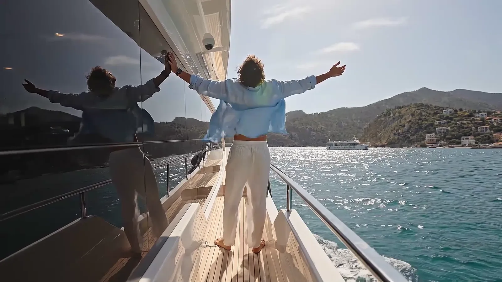 Woman wearing a Panama hat alone on a yacht